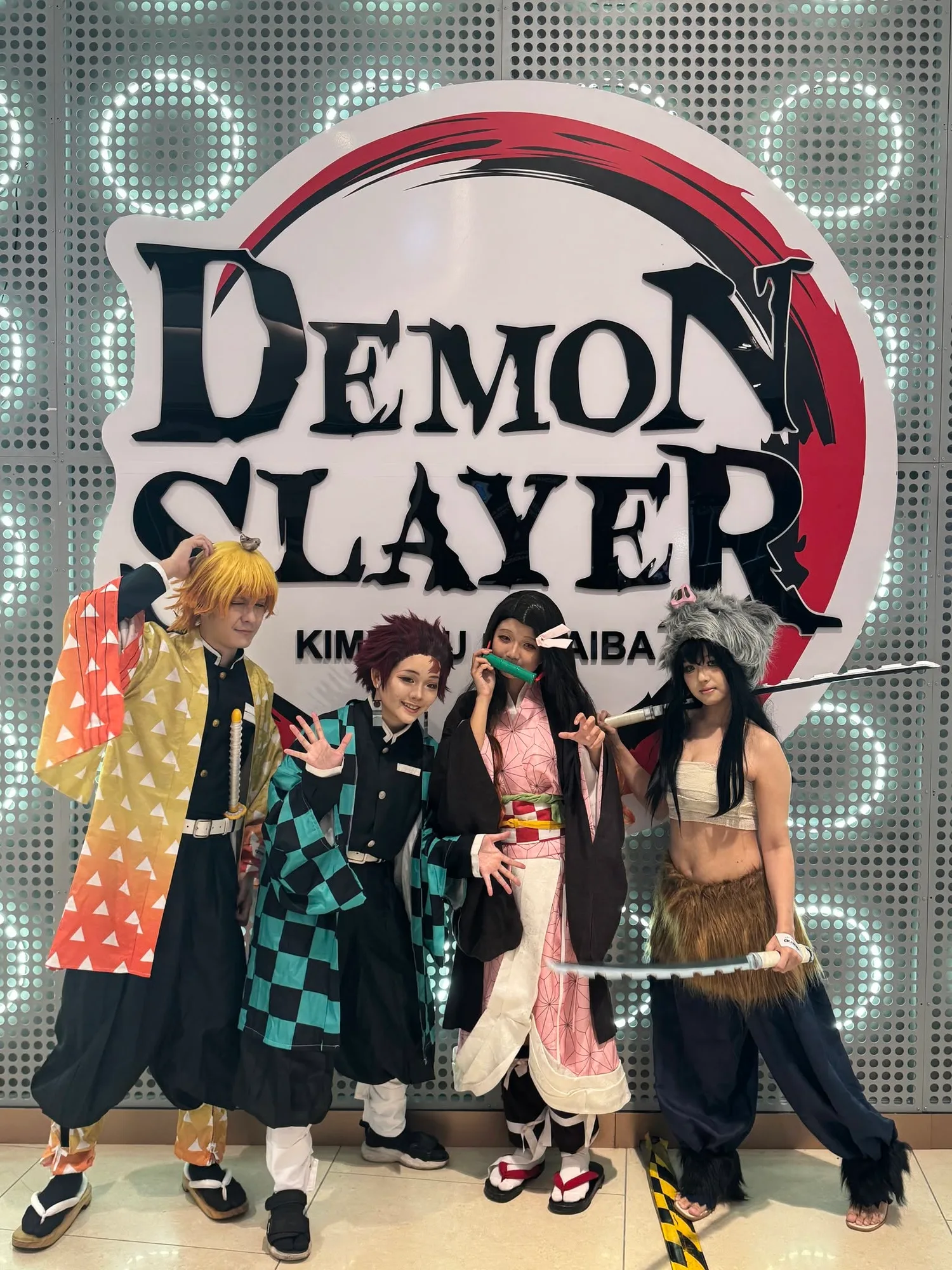 Katz holding a microphone judging a cosplay competition